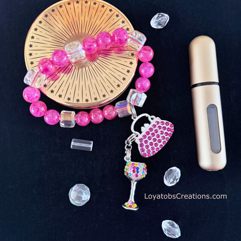Hot pink crackle bead bracelet with pink rhinestone handbag and multicolour wine glass charms flat lay on dark background - LoyatobsCreations.com
