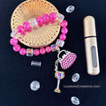 Hot pink crackle bead bracelet with pink rhinestone handbag and multicolour wine glass charms flat lay on dark background - LoyatobsCreations.com