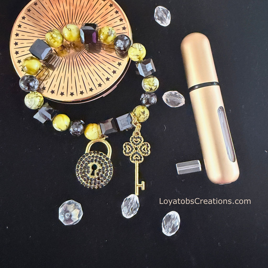Lime and black cube bead bracelet with gold pavé lock and clover key charms on dark background - LoyatobsCreations.com