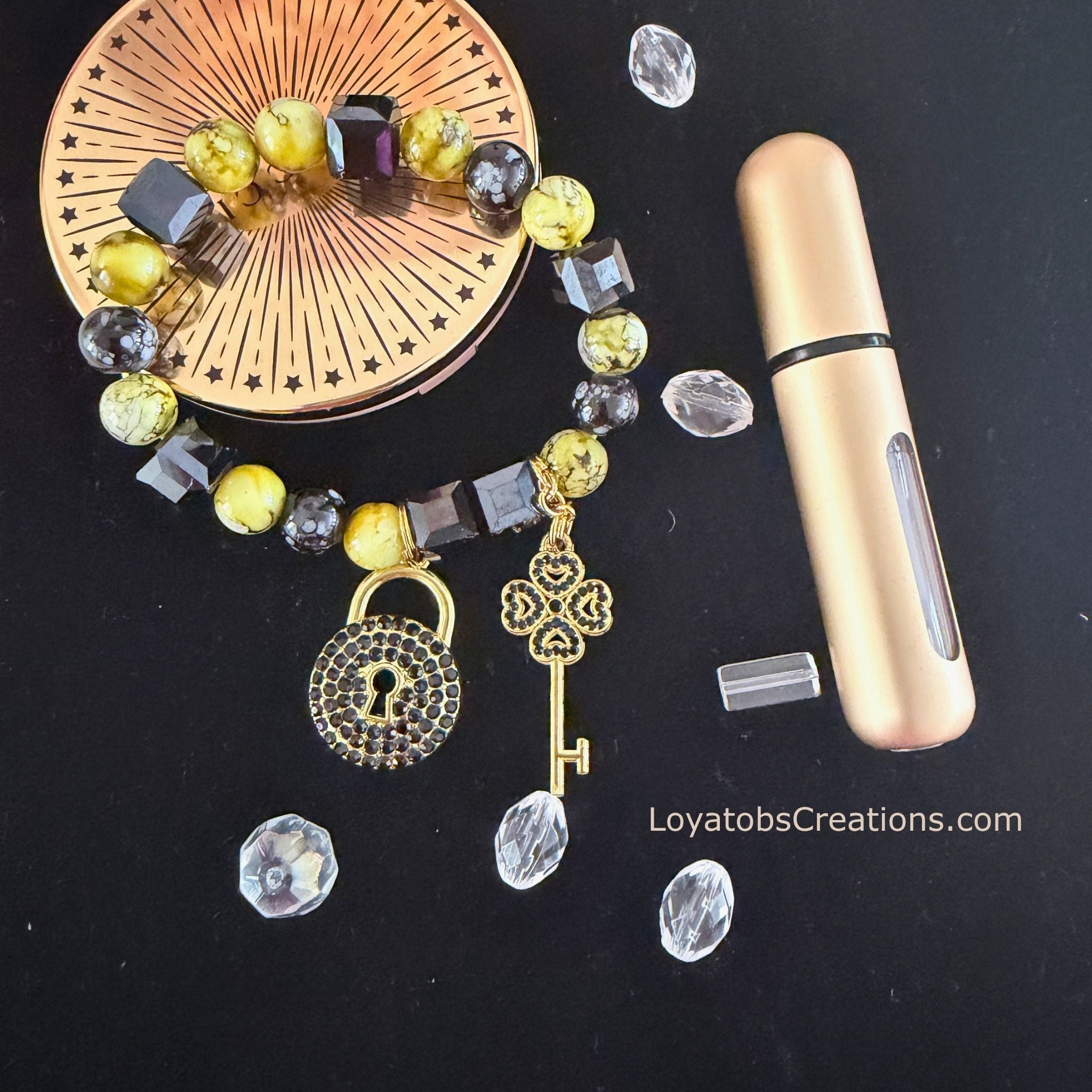 Lime and black cube bead bracelet with gold pavé lock and clover key charms on dark background - LoyatobsCreations.com