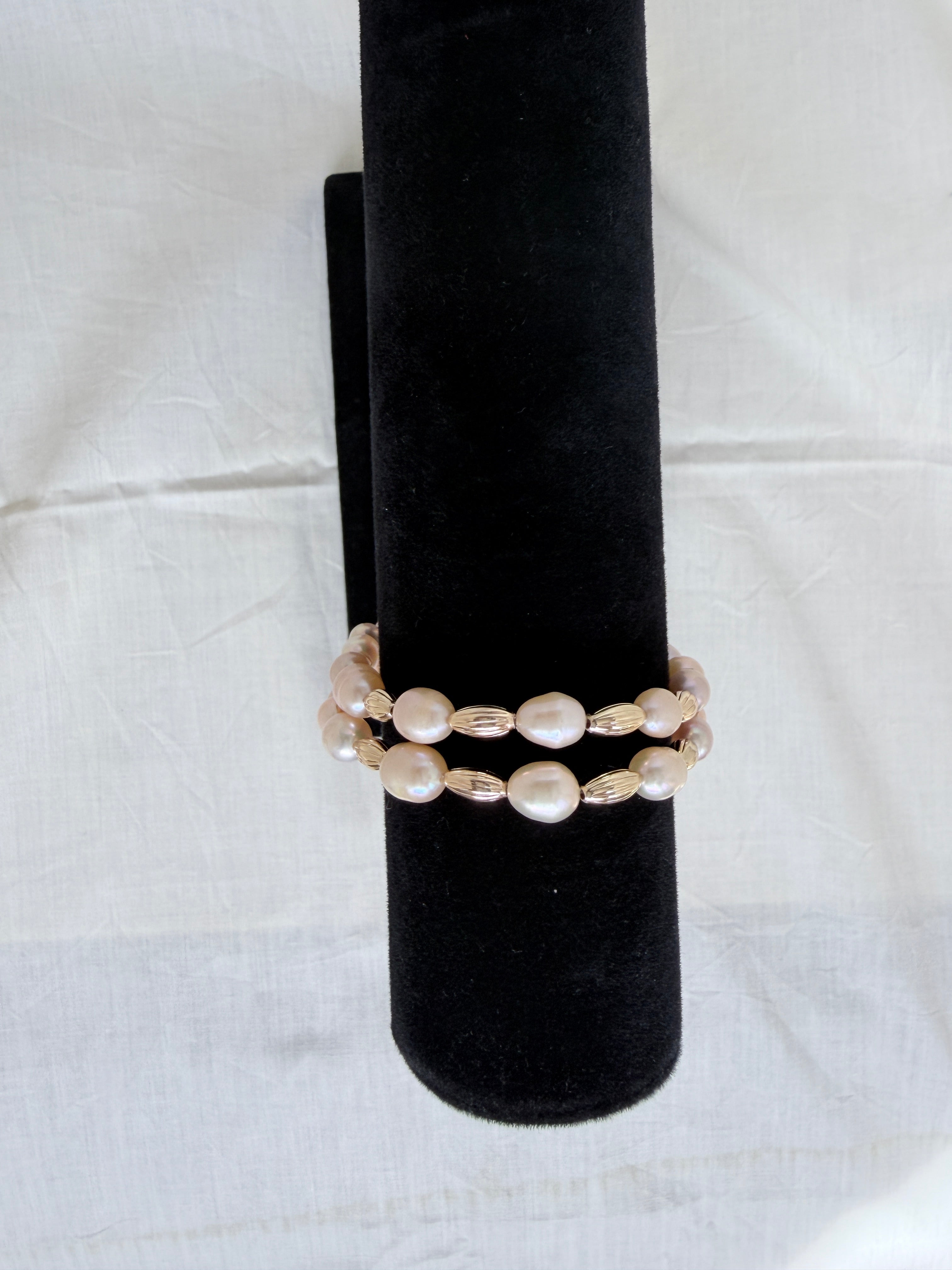 "Freshwater pearl two-row bracelet on black velvet stand showing side profile and double row design"