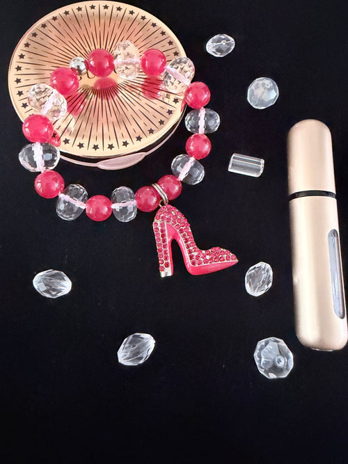 Boss Lady Heel Charm Bracelet on black velvet stand showing red  CZ stiletto heel charm with raspberry and crystal rondelle beads