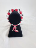 Boss Lady Heel Charm Bracelet on black velvet stand showing pink CZ stiletto heel charm with raspberry and crystal rondelle beads