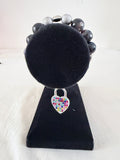 Locked in Love Charm Bracelet on black velvet stand showing multicolour rhinestone silver heart padlock charm with purple banded agate and silver stardust beads