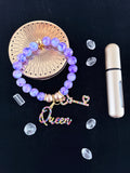 Purple marble bead bracelet with multicolour rhinestone Queen and key charms flat lay on dark background - LoyatobsCreations.com