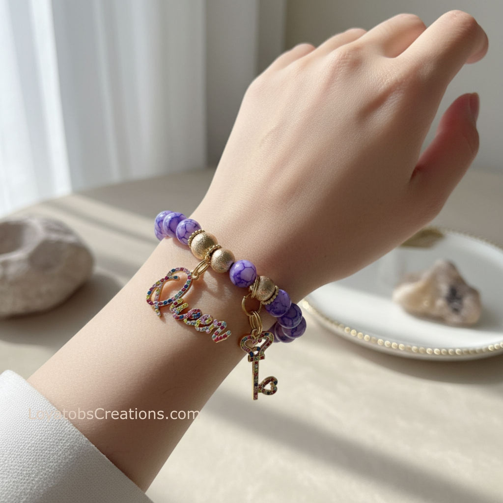 Purple marble bead bracelet with multicolour rhinestone Queen and key charms worn on wrist - LoyatobsCreations.com