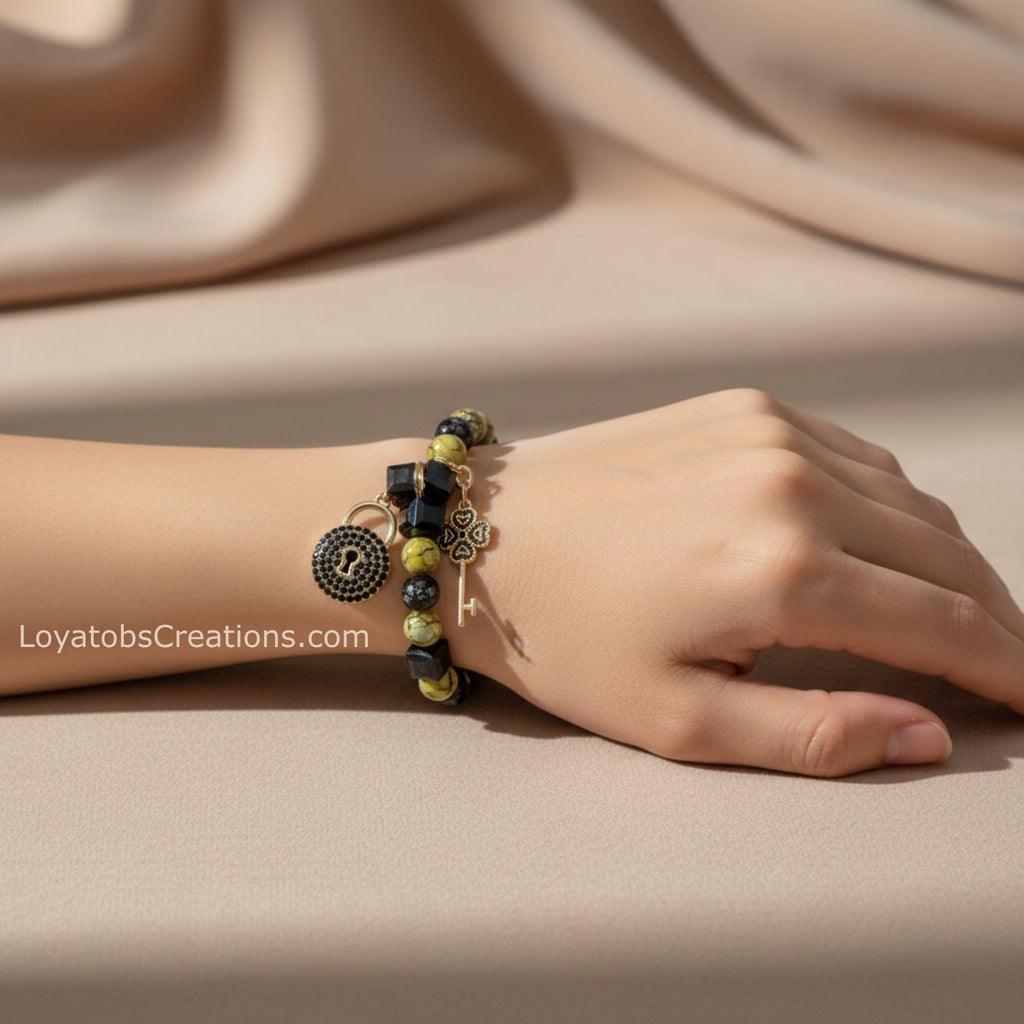 Lime and black bead bracelet with gold pavé lock and clover key charms worn on wrist - LoyatobsCreations.com