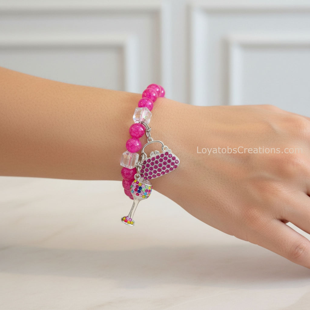 Hot pink crackle bead bracelet with pink rhinestone handbag and multicolour wine glass charms worn on wrist - LoyatobsCreations.com
